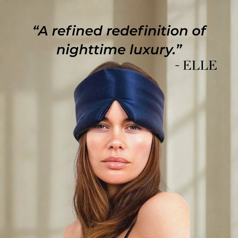 Woman wearing GLOWE Deep Sleep Mask in Deep Navy, lifestyle editorial shot