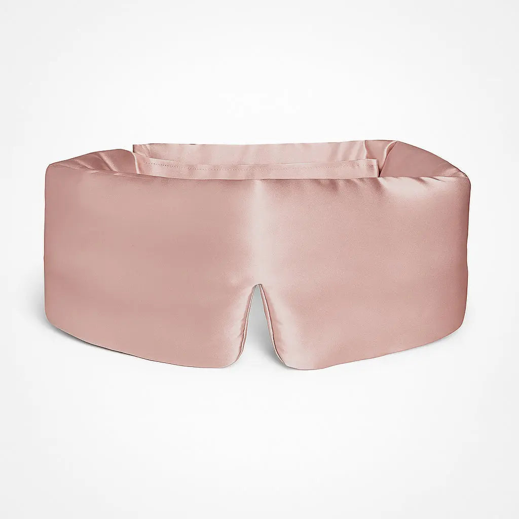 Deep Sleep Mask in Soft Blush, front view showing 23 momme mulberry silk and contoured nose bridge