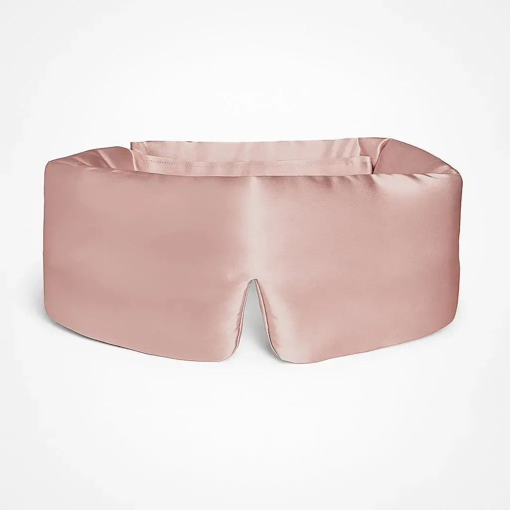 Deep Sleep Mask in Soft Blush, front view showing 23 momme mulberry silk and contoured nose bridge
