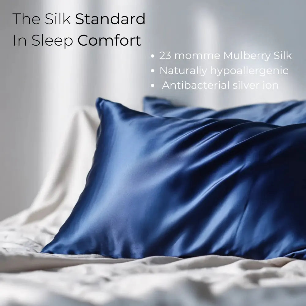 GLOWE Silk Pillowcases in Deep Navy on bed, 23 momme mulberry silk, hypoallergenic, antibacterial silver ion