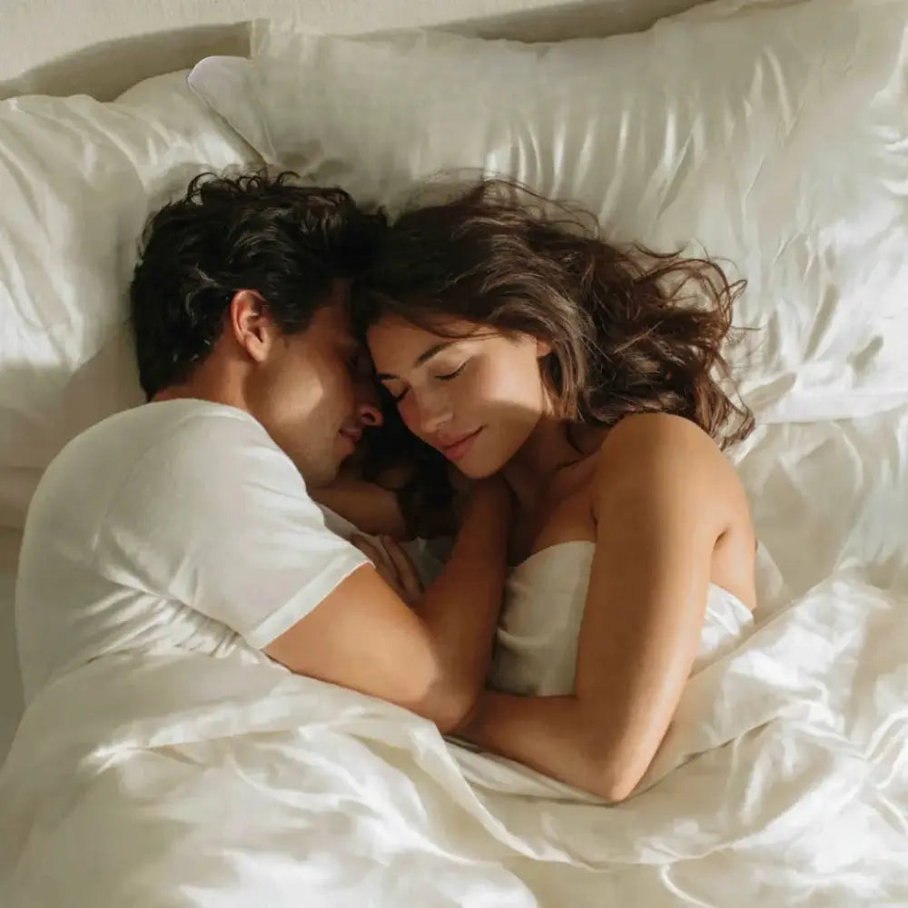 Couple sleeping on GLOWE Silk Pillowcases, his and hers set