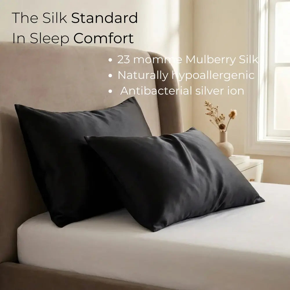 GLOWE Silk Pillowcases in Midnight Black on bed, 23 momme mulberry silk, hypoallergenic, antibacterial silver ion
